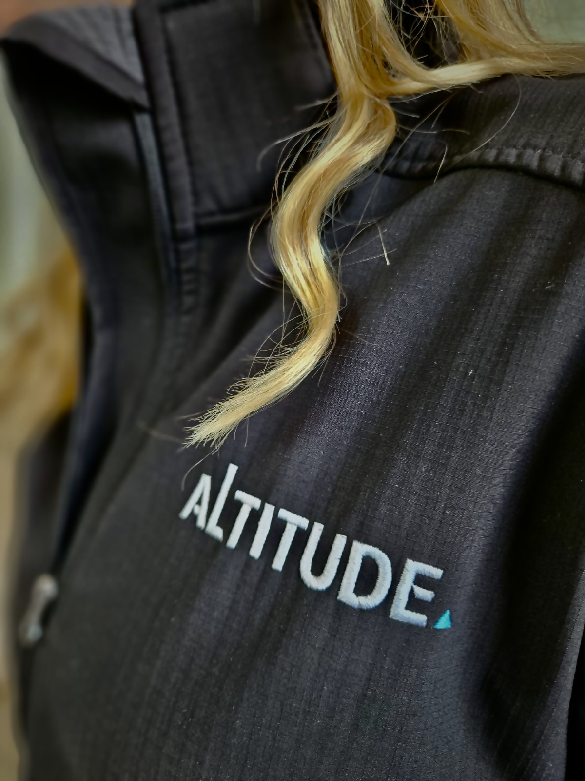 Altitude wordmark embroidered on a jacket